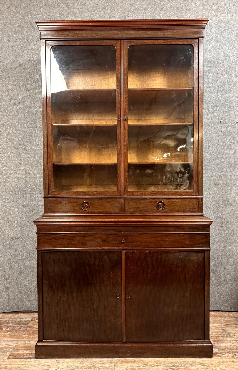 Cabinet formant buffet à secrétaire dissimulé et bibliothèque en acajou moucheté époque Napoléon III vers 1850.